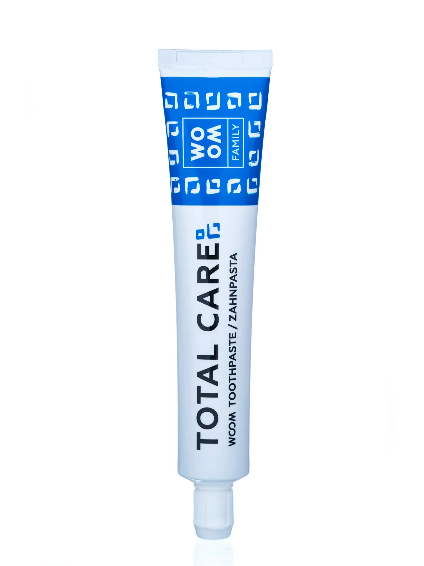 Original plain product photo of a Woom Total Care toothpaste tube on a white background
