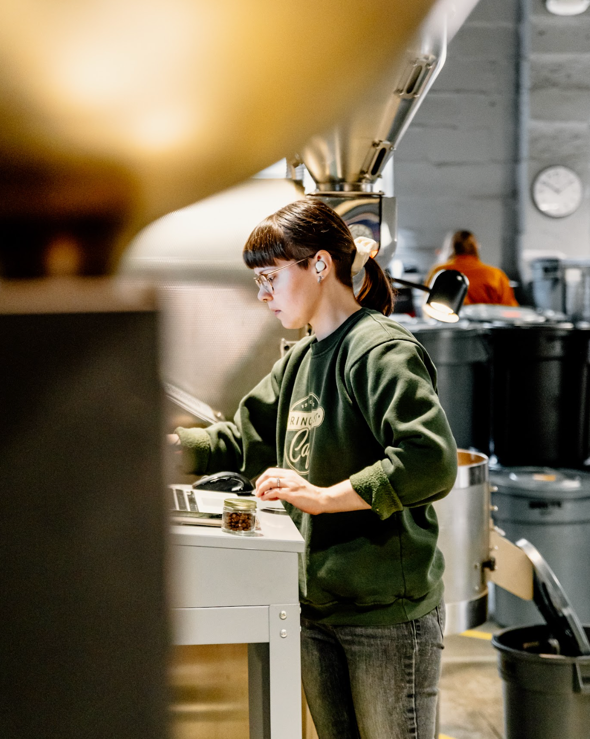 A roaster on the Passenger team monitors a batch of coffee