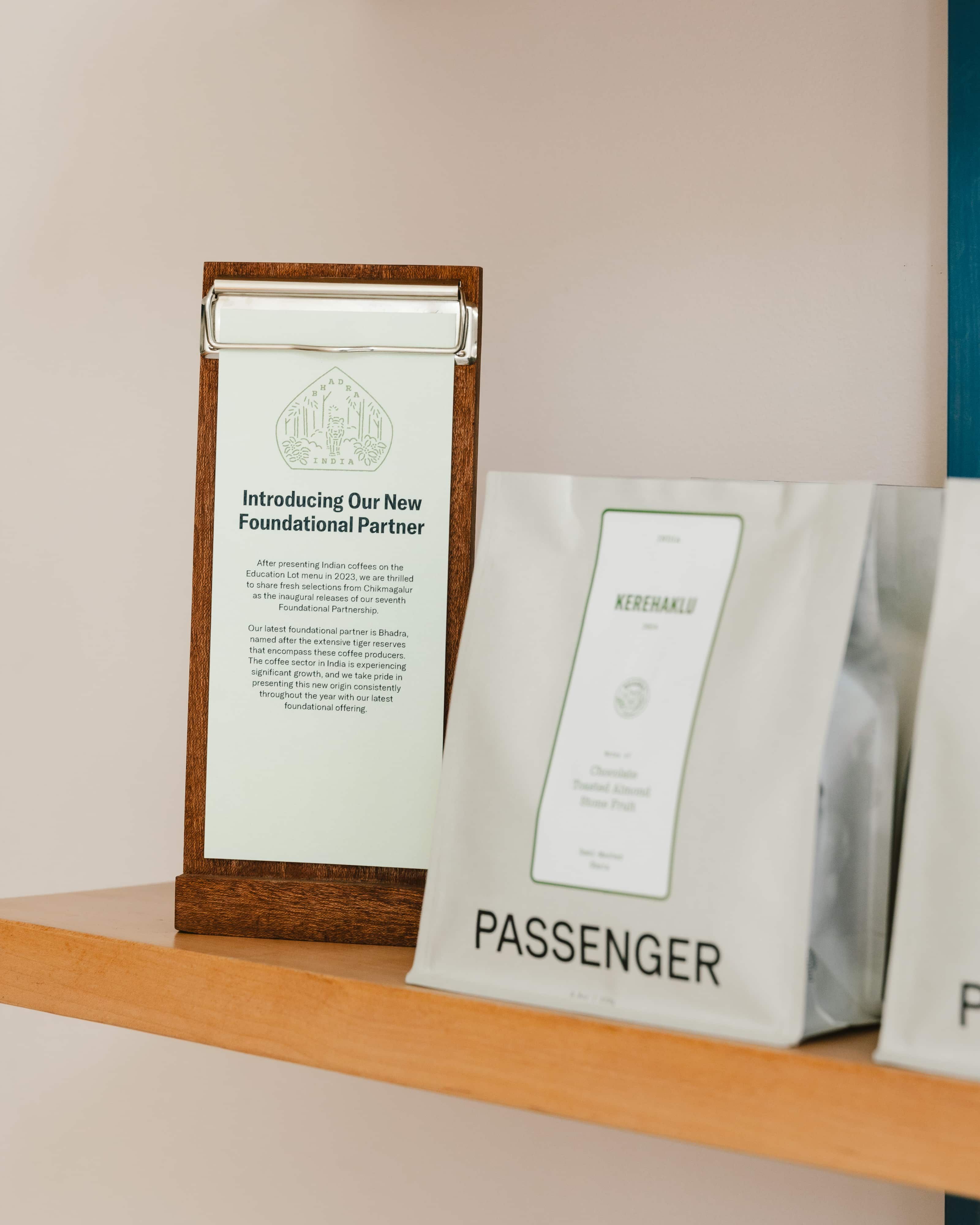 A retail shelf at Passenger's cafè with coffee bags on it