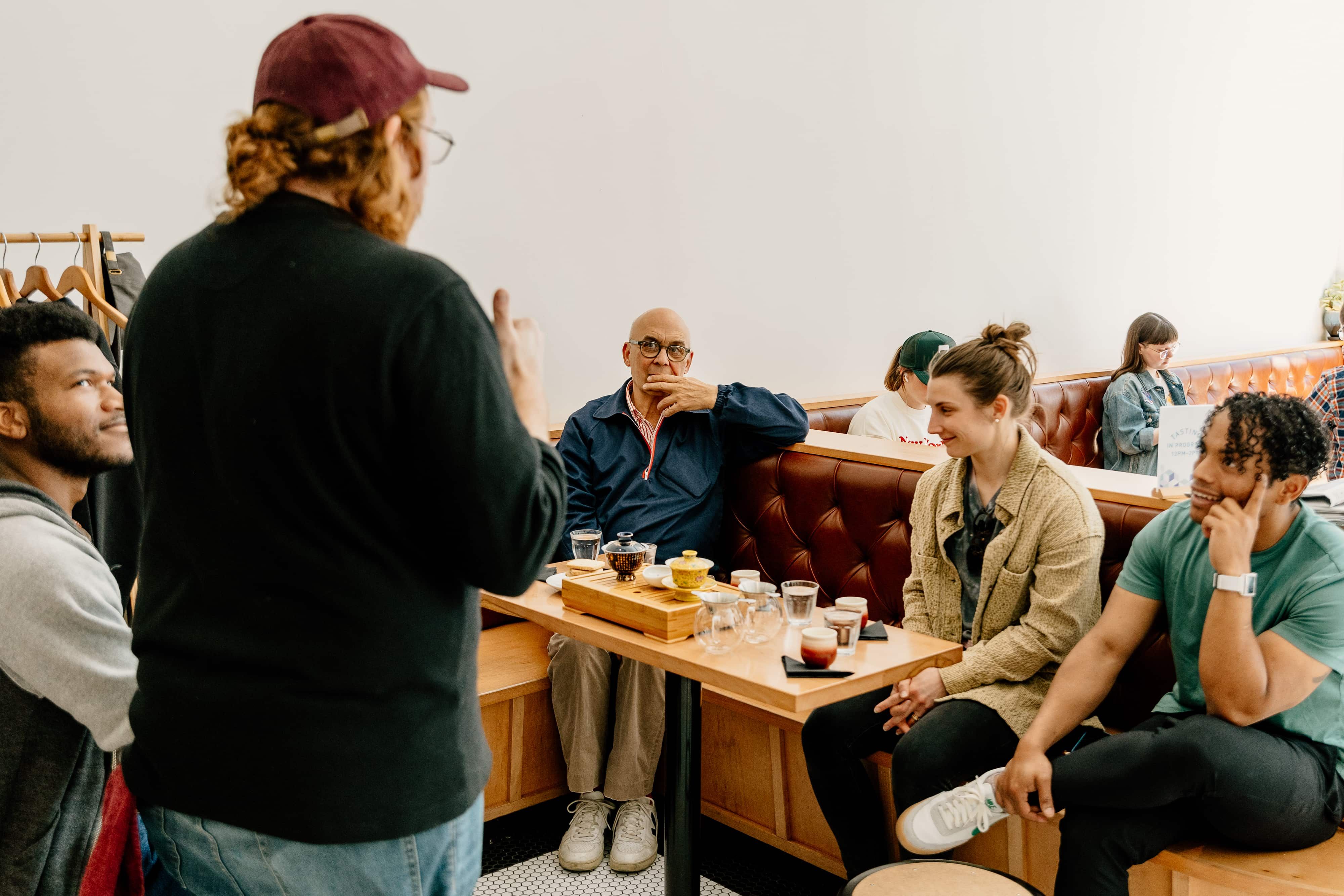 Guests attend a tea education class at the Passenger King St. Showroom