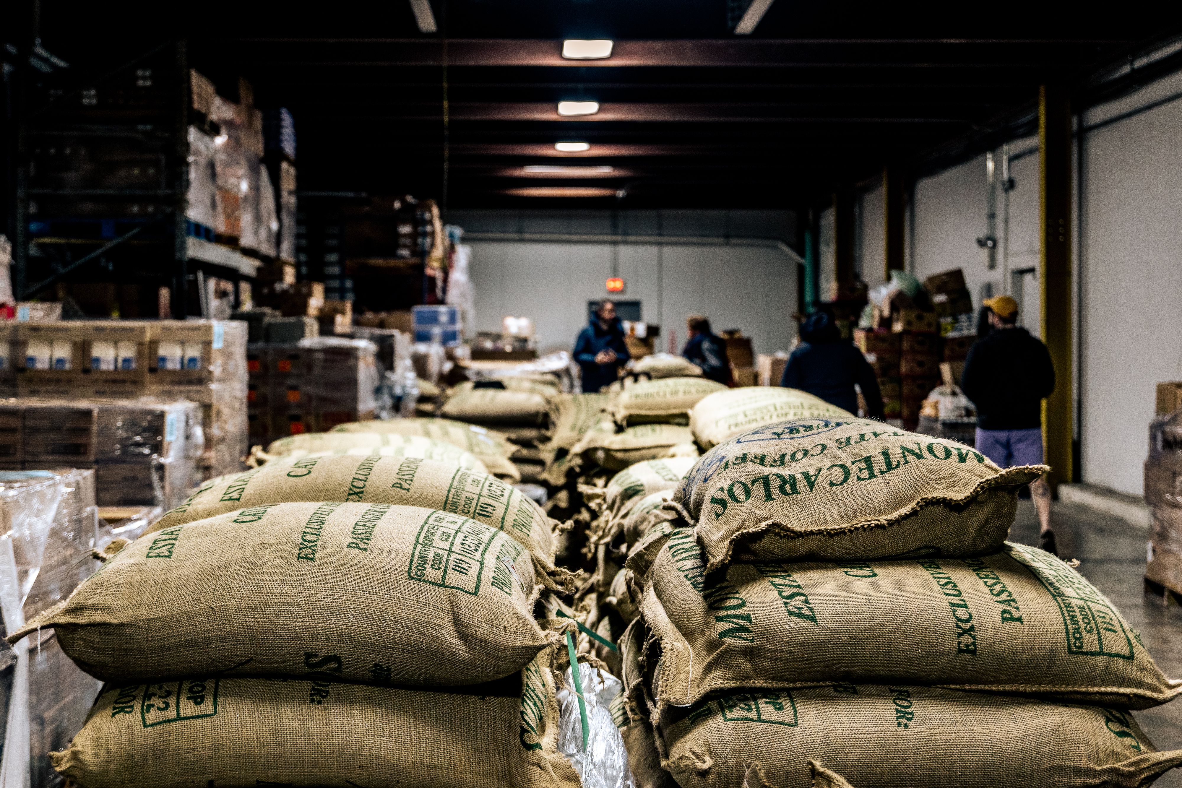 Large bags of coffee being preserved in our freezer facility