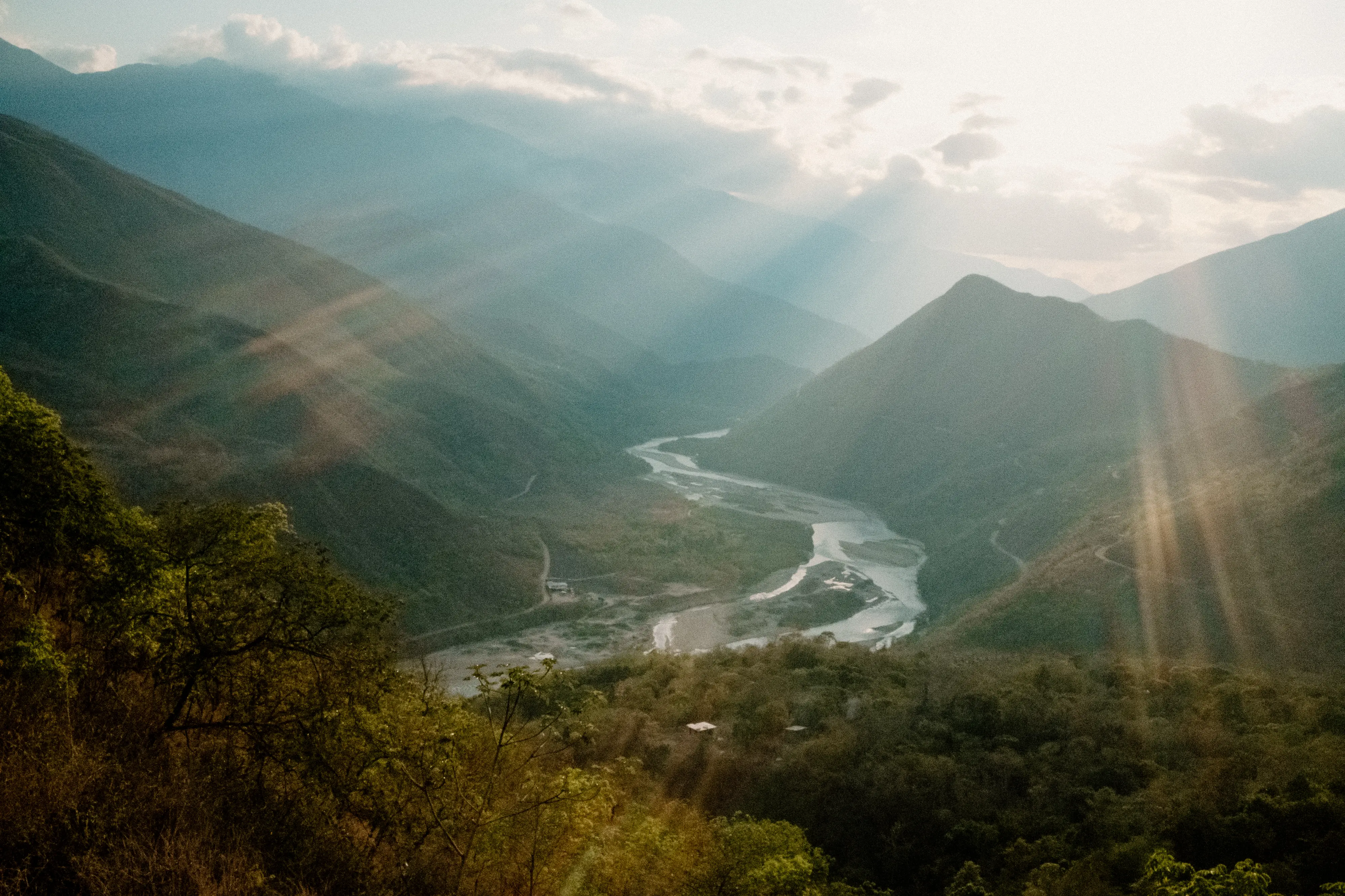 Sun shines through the valley over the Cusco region of Peru