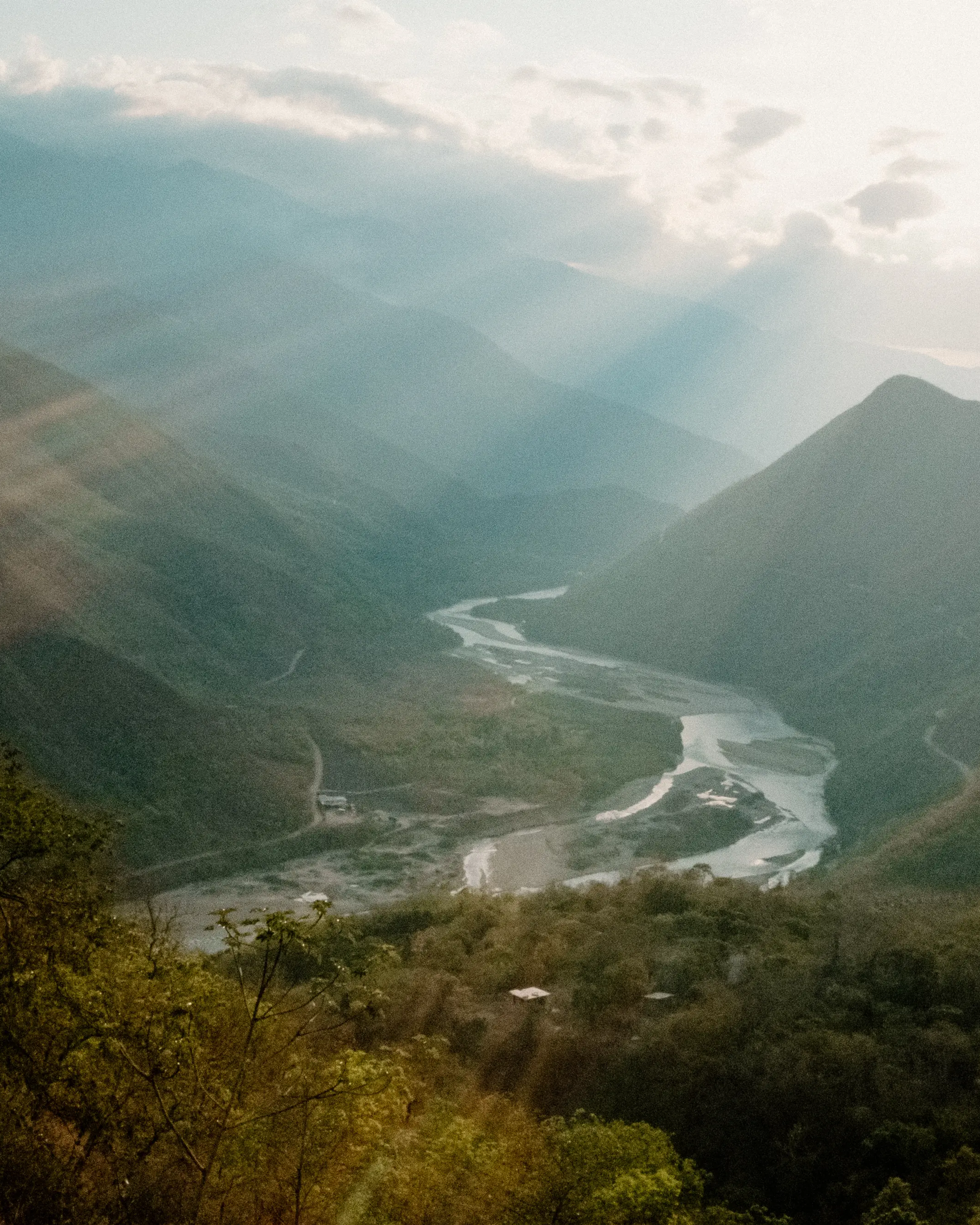 Sun shines through the valley over the Cusco region of Peru