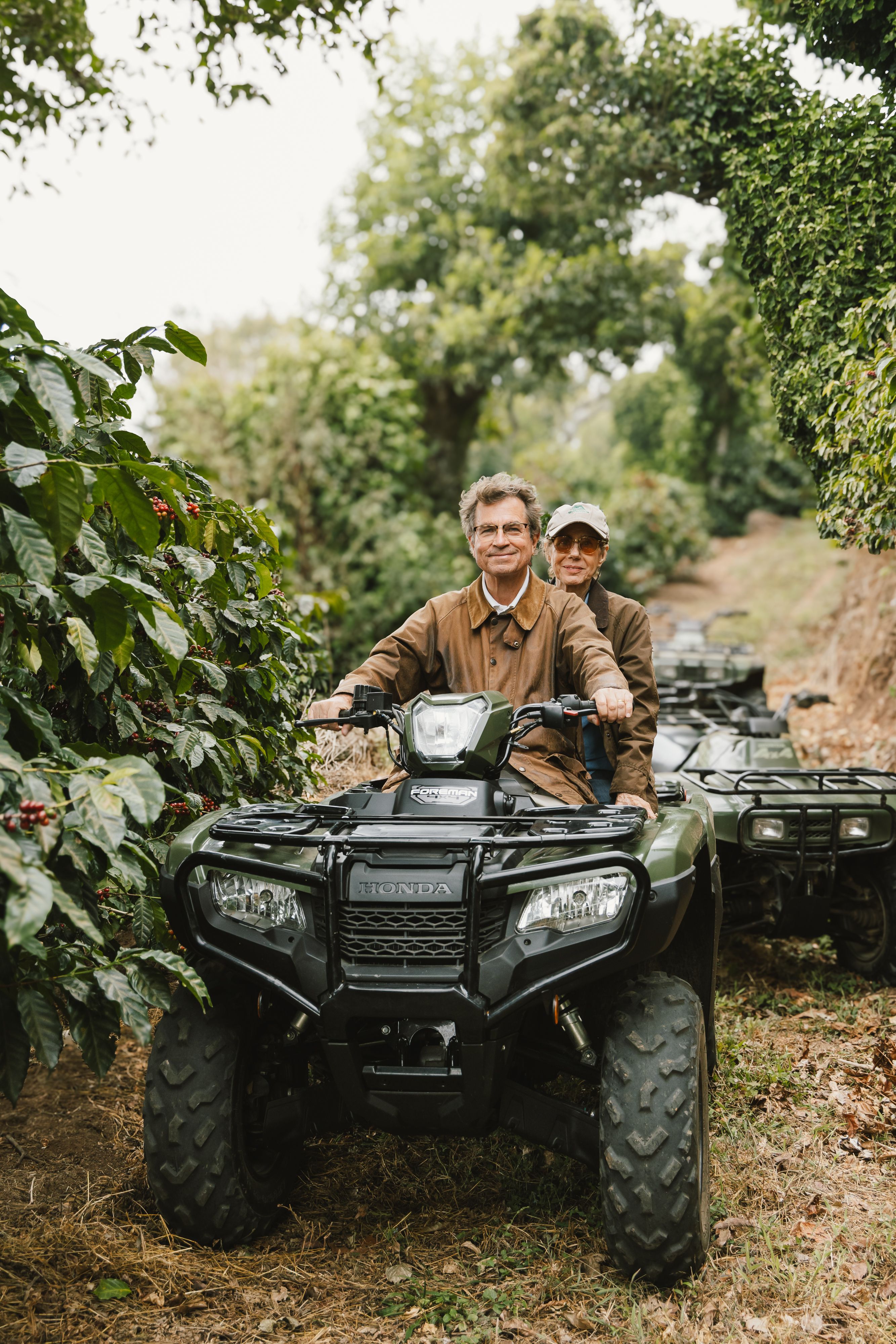 Carlos & Julie Batres riding a four wheeler on the Montecarlos Estate