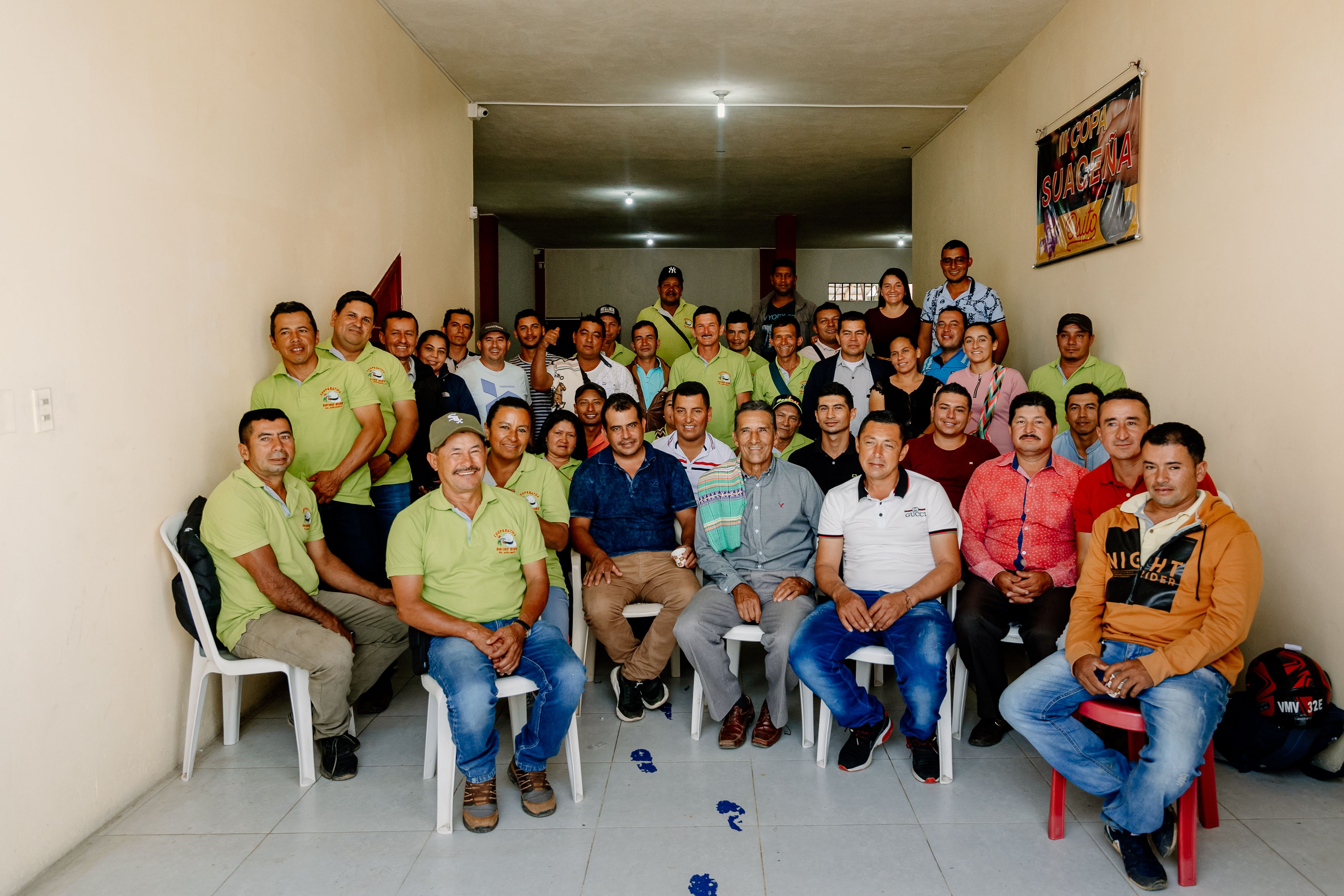 Producers of the Divino Niño Partnership sitting in a room