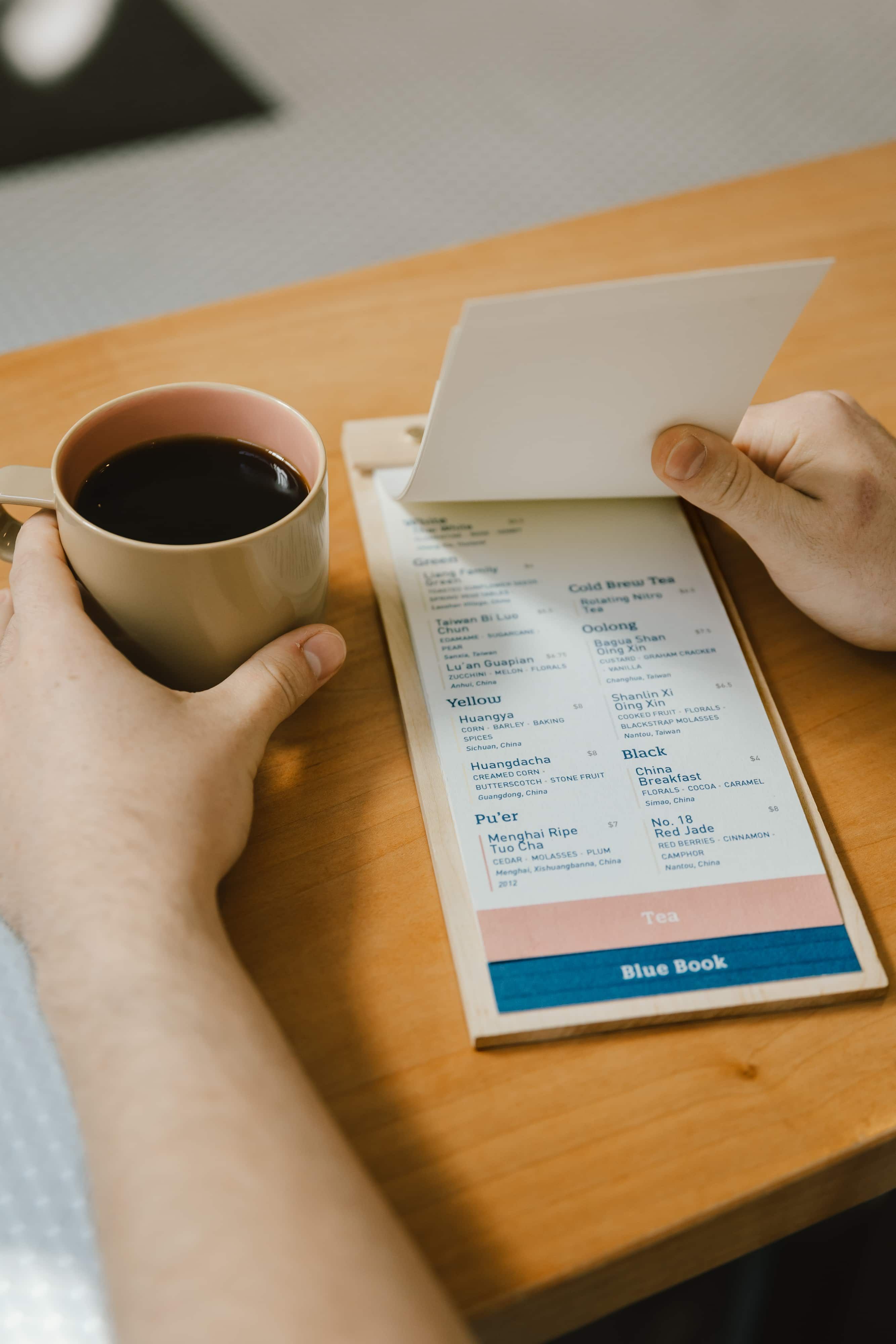 A guest flips through the Passenger menu