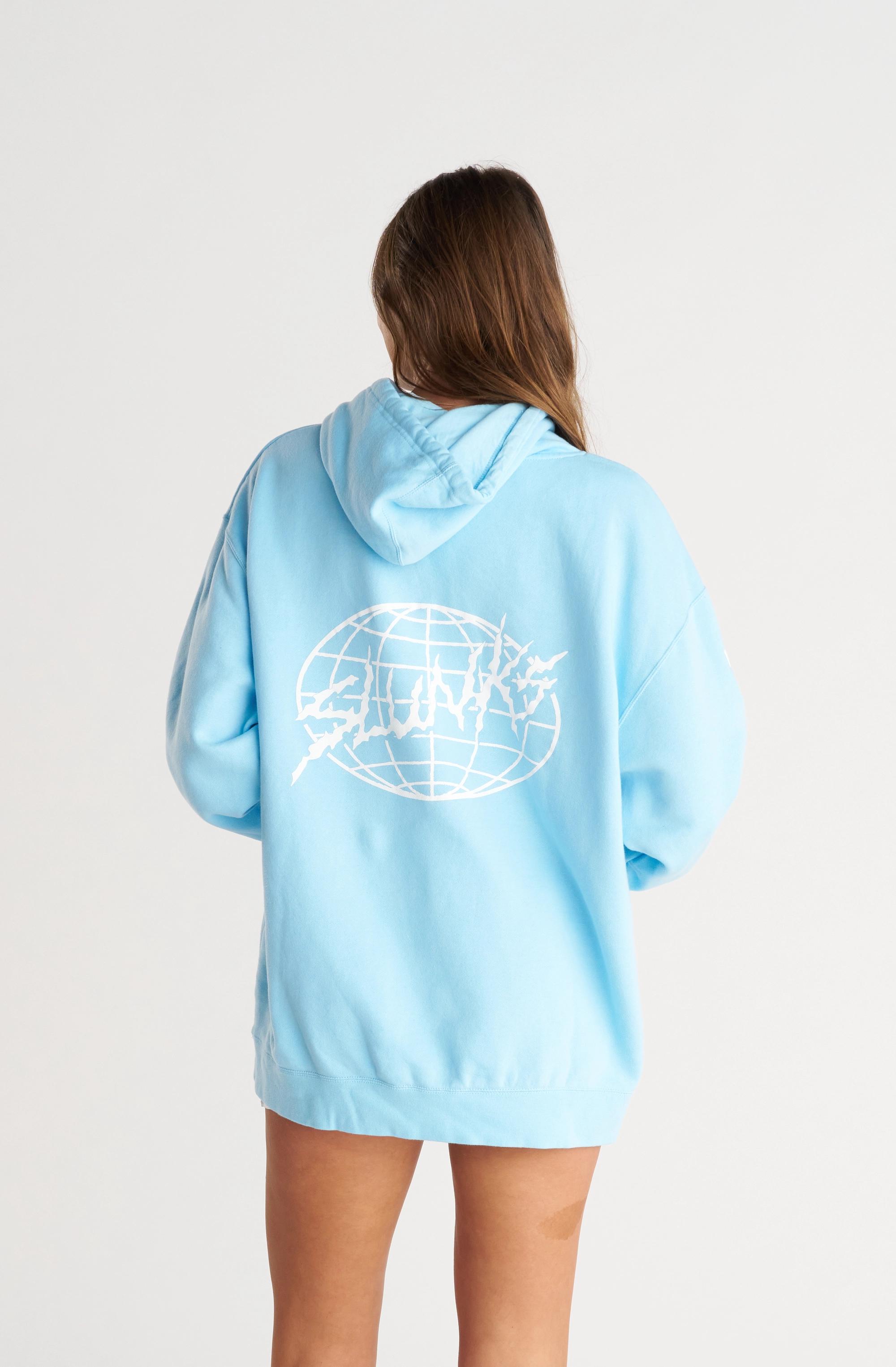 Girl wearing light blue hoodie with white graphics & text