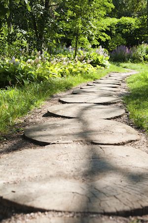 Garden Path Made of Round Stone Tiles
