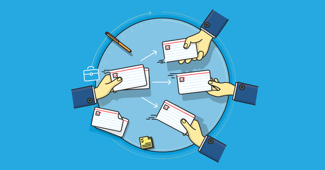 Hands holding index cards showing user stories