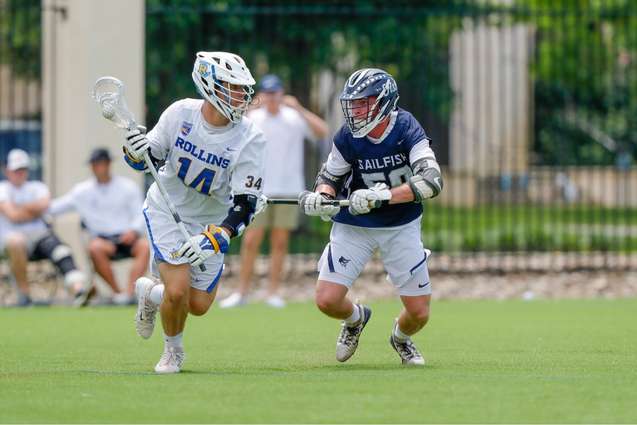 Lacrosse players competing against each other.