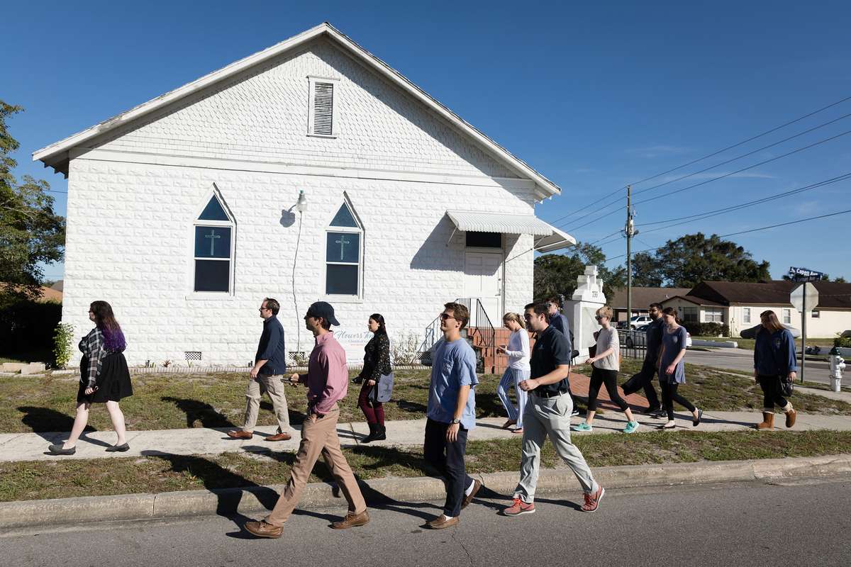 College students walking past a local church.