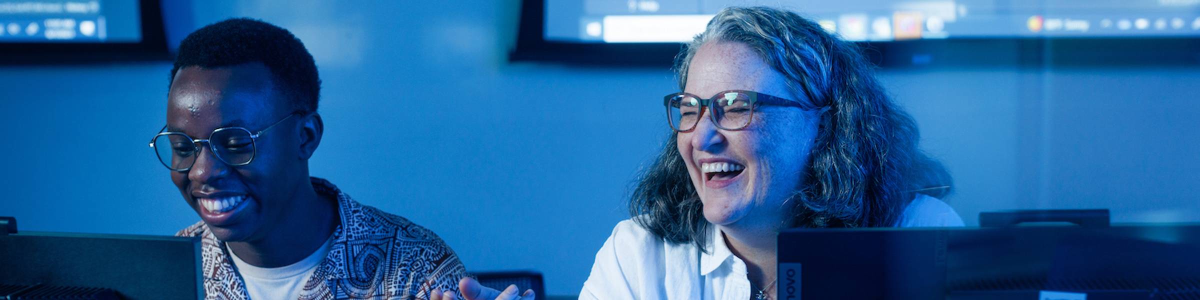 Rollins College computer science profesor, Valerie Summet, laughs while working with a student.