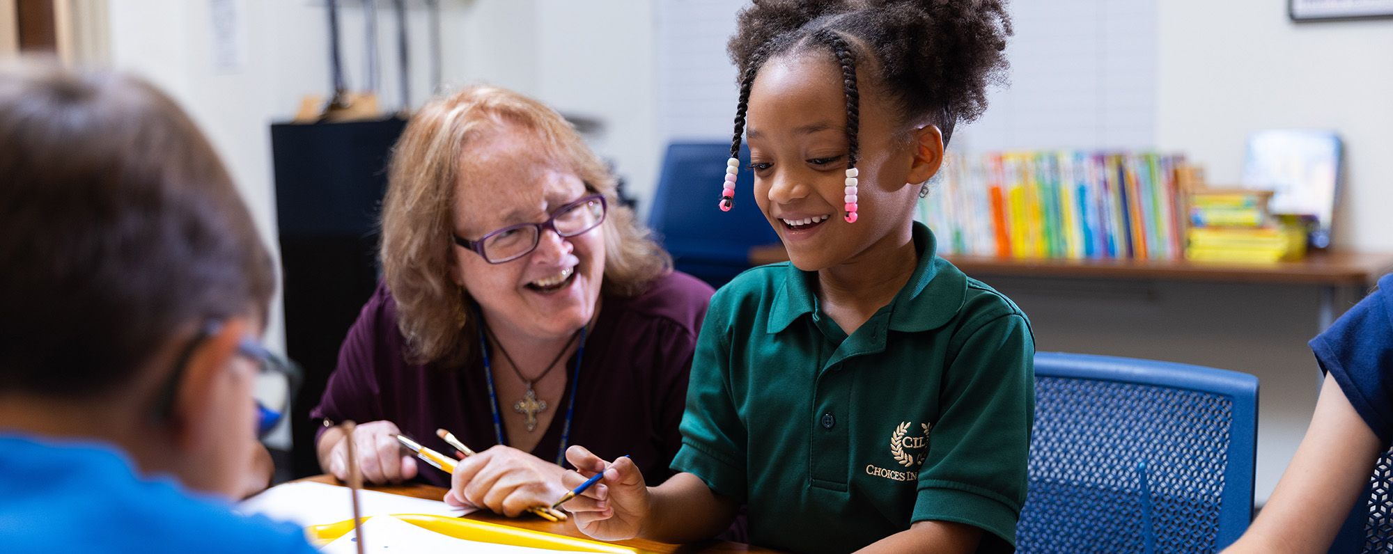 A parent walking with their student to the educare program.