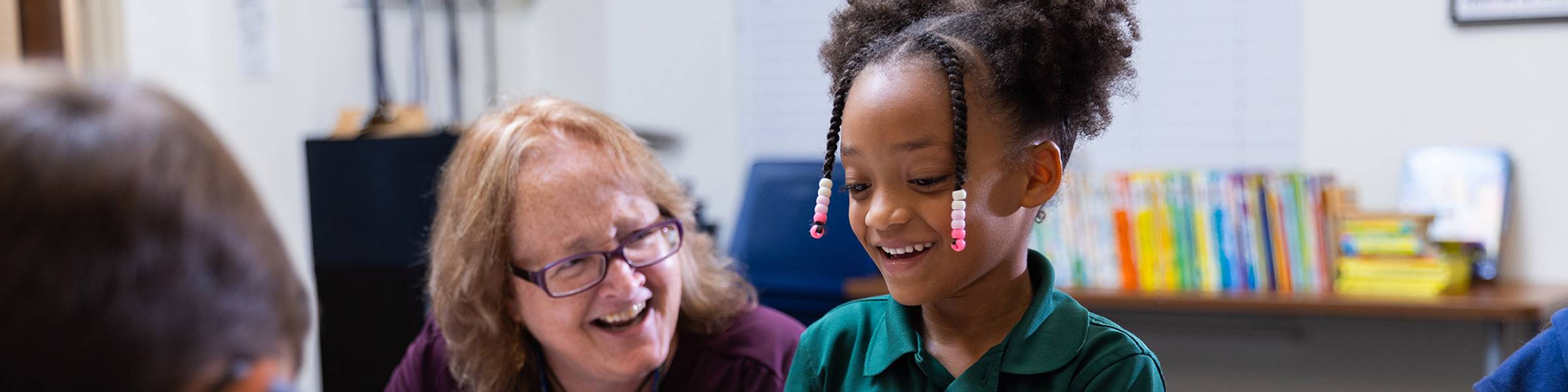 A parent walking with their student to the educare program.