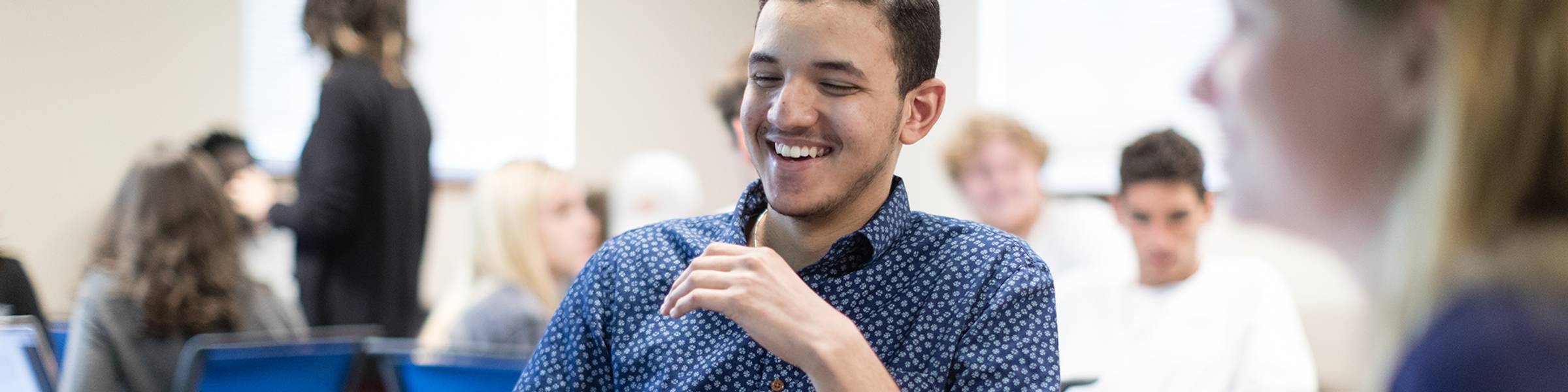 Rollins international business classroom, where students are broken out into small working groups.