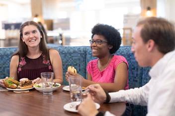 Students enjoy a meal in Skillman Dining Hall