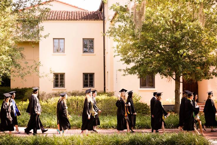 Rollins students walk to their commencement ceremony. 