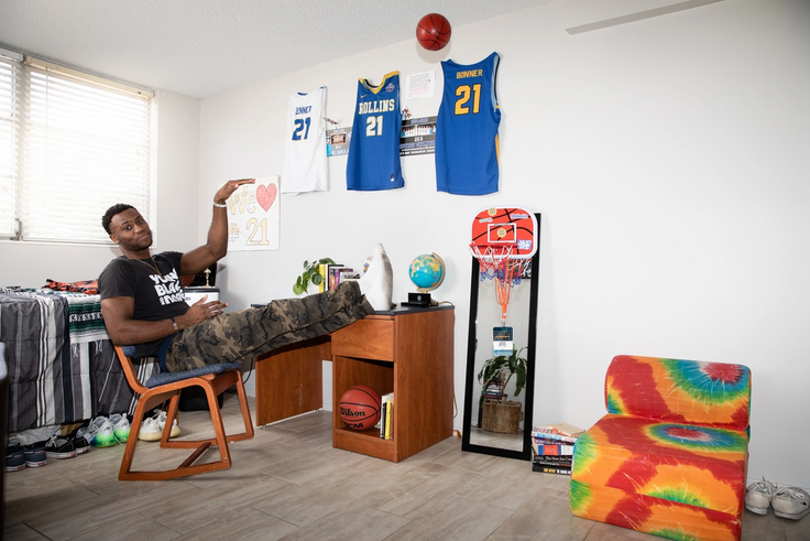 Jakobi Bonner ’20 ’21MBA tosses a play basketball in his dorm room.