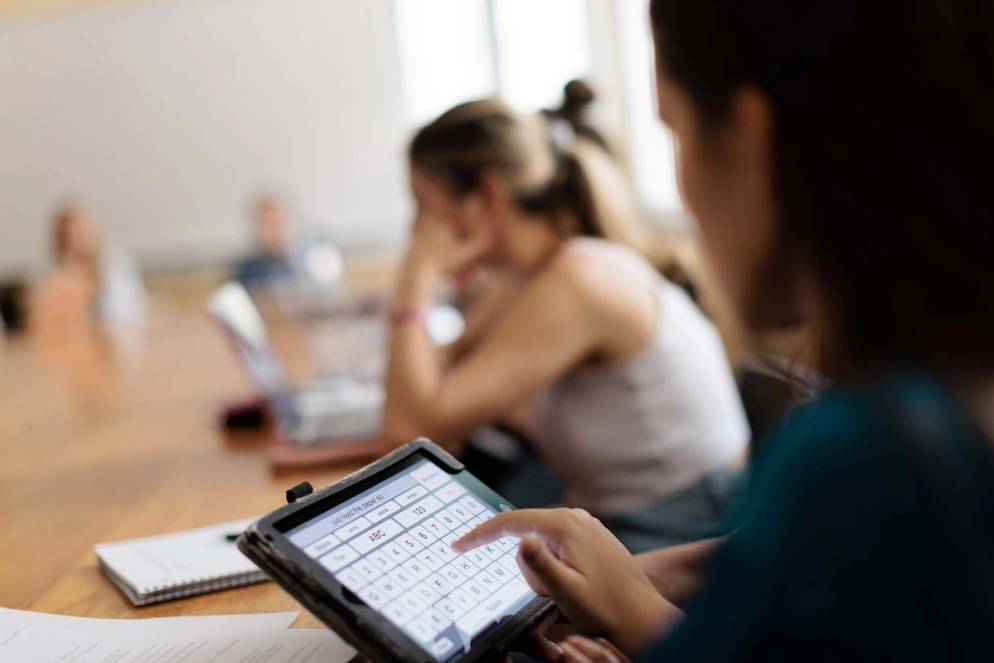 Elizabeth Bonker uses a keyboard to type in class. 