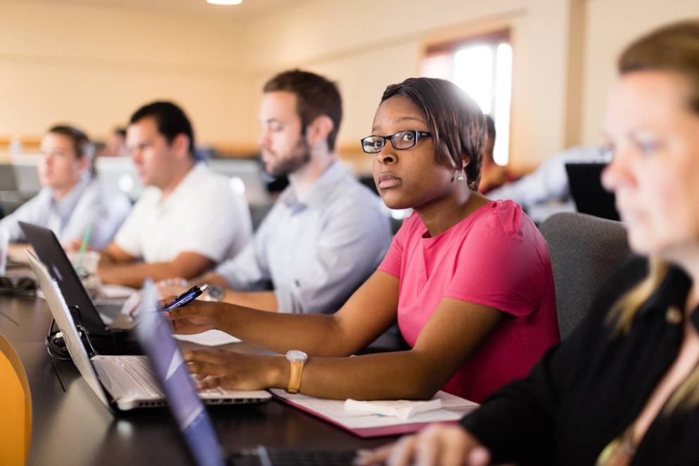 Crummer Graduate School of Business students in a classroom.