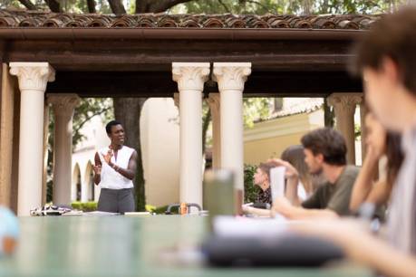 Rollins College students participating in outdoor class.