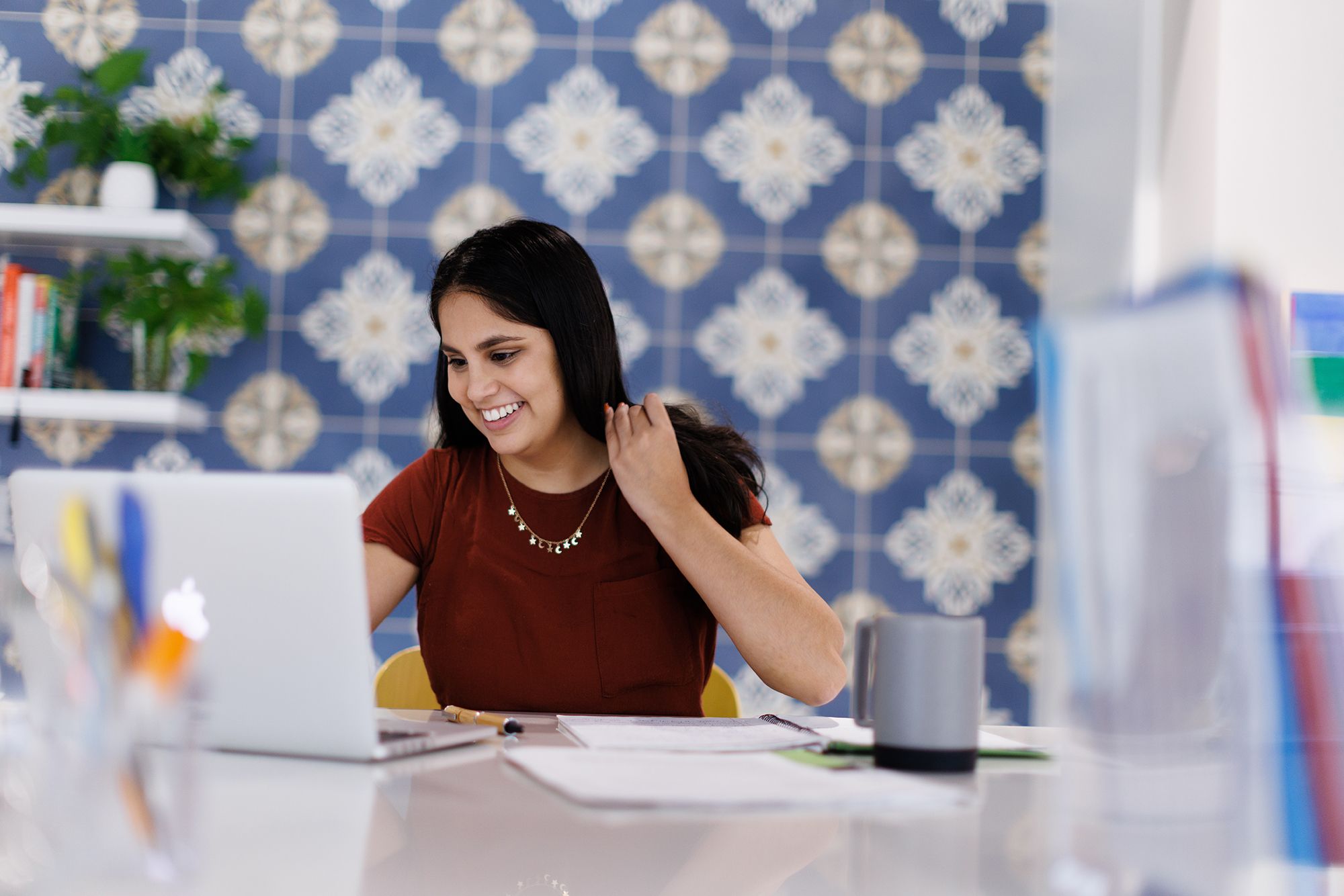 A Rollins student chats with someone on a computer.