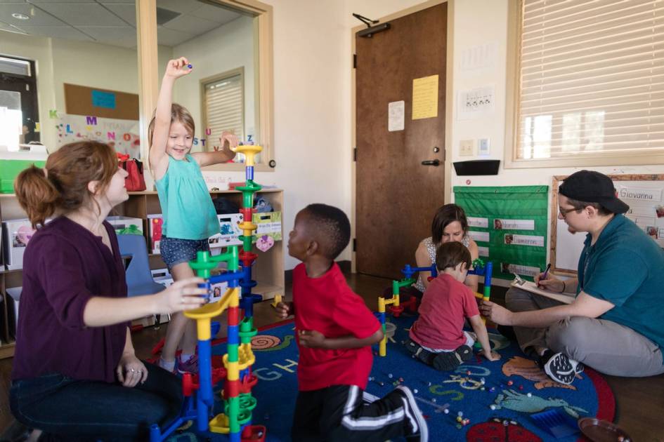 Rollins student plays and works with children at the Child Development & Student Research Center.