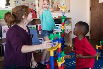 Students work with children in Rollins' Child Development Center.