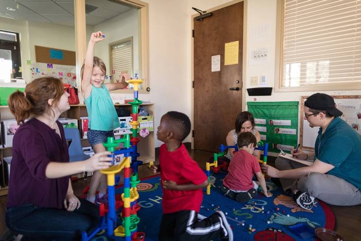 Rollins student plays and works with children at the Child Development & Student Research Center.