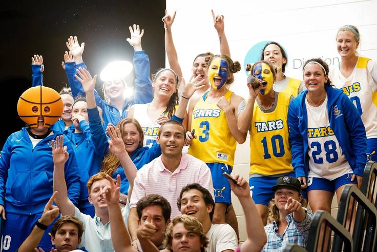 Tars fans dressed up in blue and gold to cheer on the basketball team.