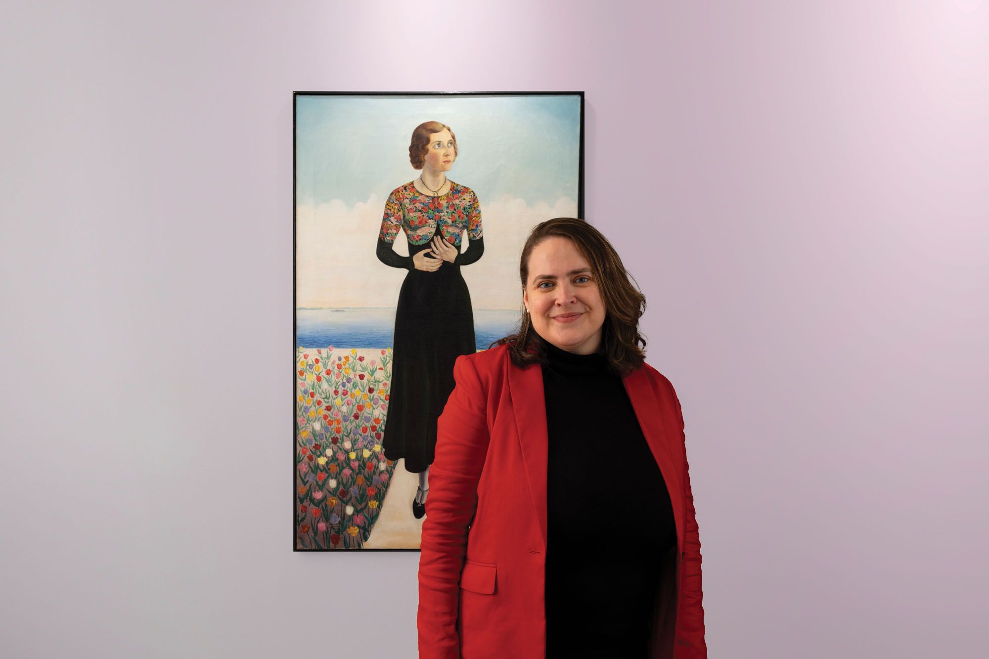 Leslie Anderson pictured in front of a piece of artwork at the Rollins Museum of Art