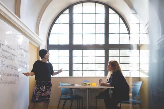 A professor works one on one with a student.