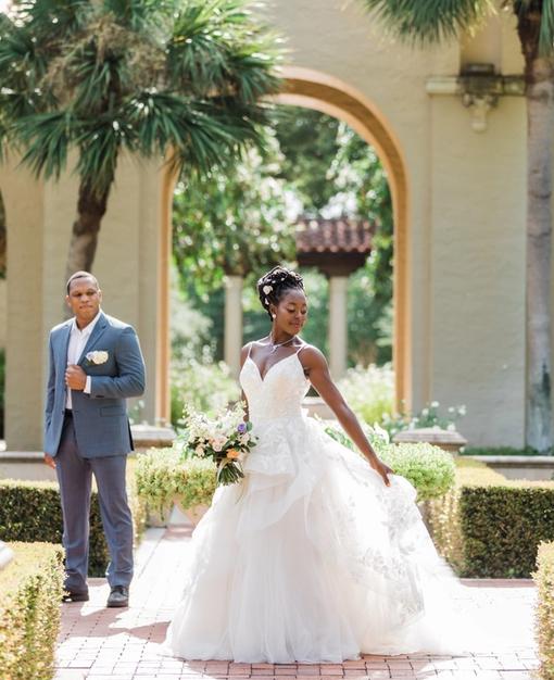 A bride and groom in Rollins' rose garden