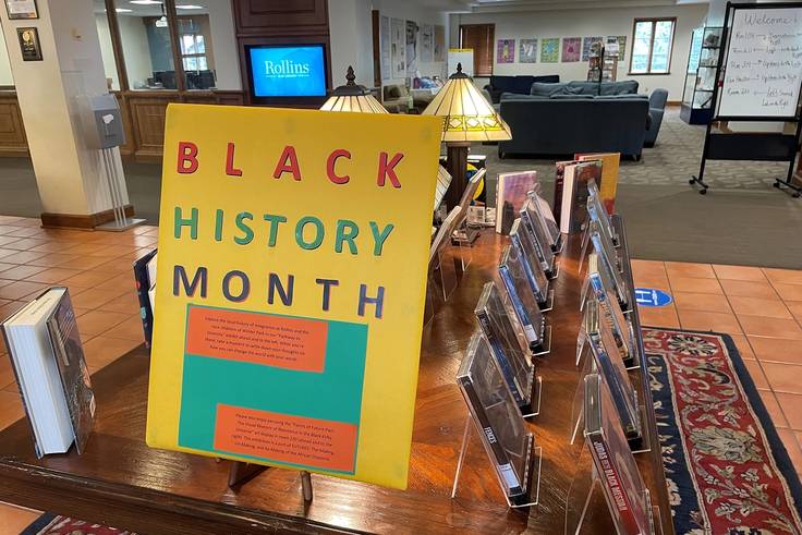 Tables of books and films celebrating Black History Month at Rollins’ Olin Library.