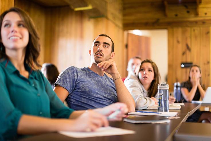 Philosophy students engrossed in a lecture.