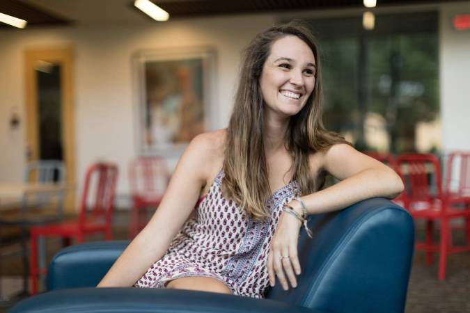Sara Jane Renfroe sits in Bush Science Center at Rollins College