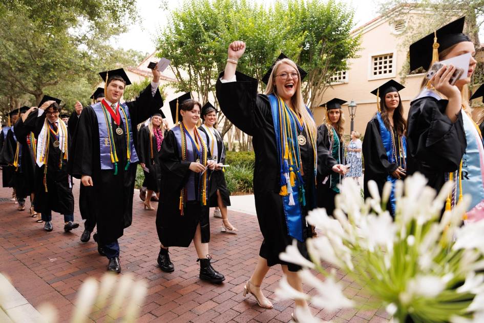 Students processing in commencement gowns