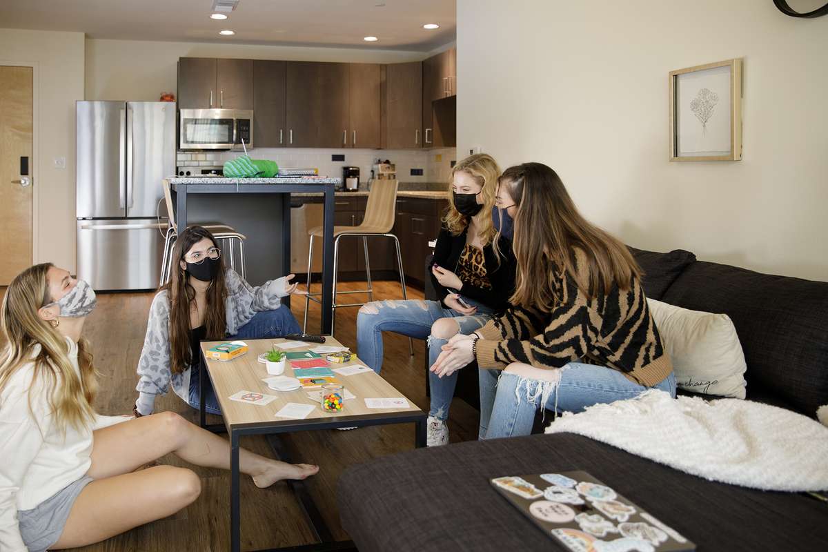 Students gather in their communal living room in Lakeside Neighborhood for game night.