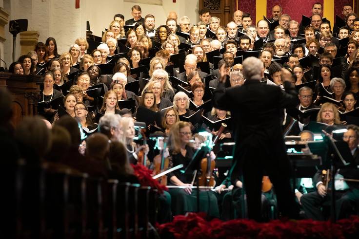 Music professor John Sinclair conducting the Bach Festival Choir holiday concert, which aired on PBS.