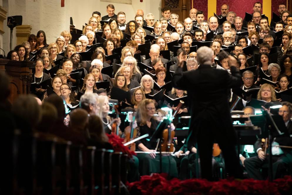 Music professor John Sinclair conducting the Bach Festival Choir holiday concert, which aired on PBS.