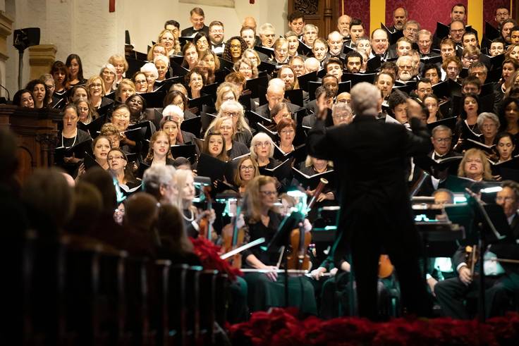 Rollins choir performs at Knowles Memorial Chapel, with professor John Sinclair conducting.