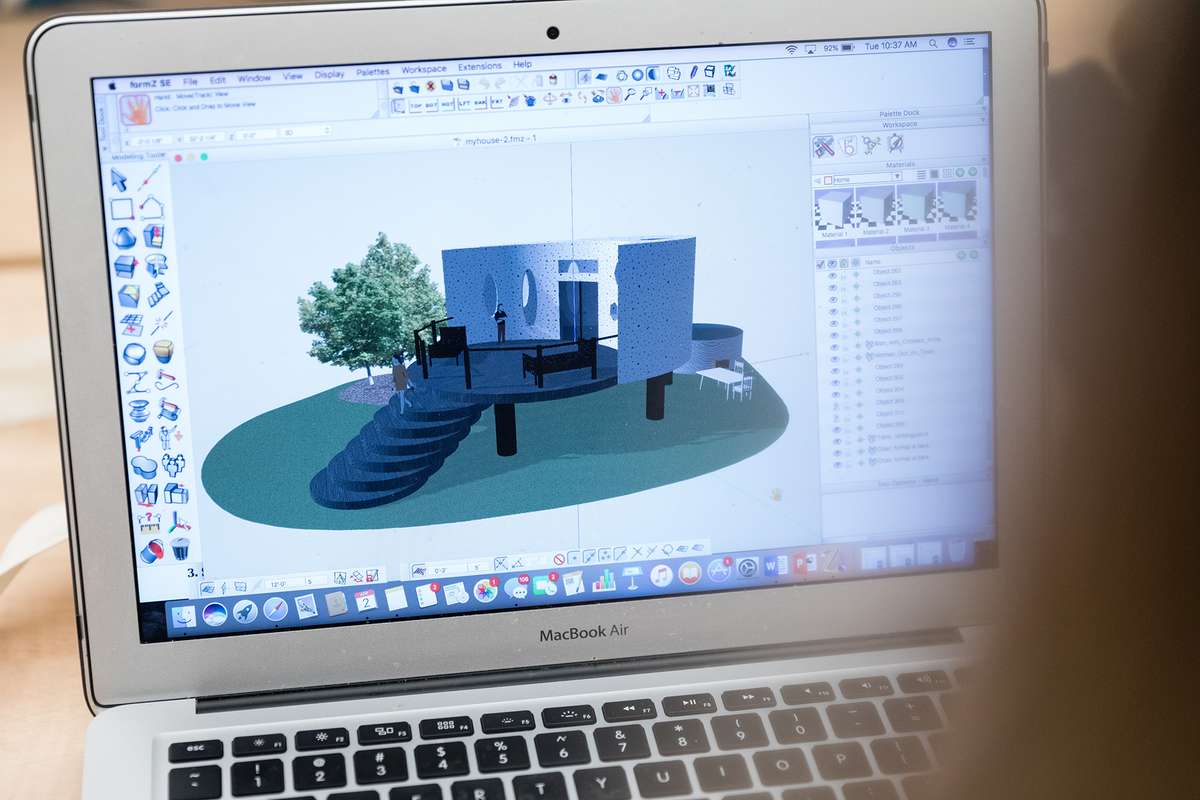 A rendering on a MacBook laptop of an elevated round tiny home in FormZ 3D.