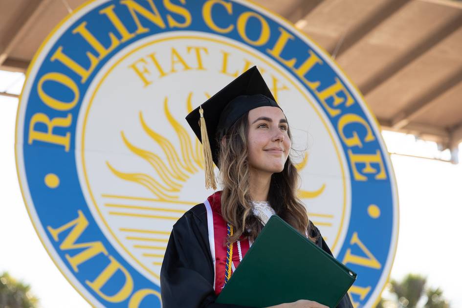 Rollins student in cap and gown