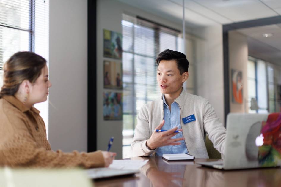 A Rollins student sits with a counselor. 