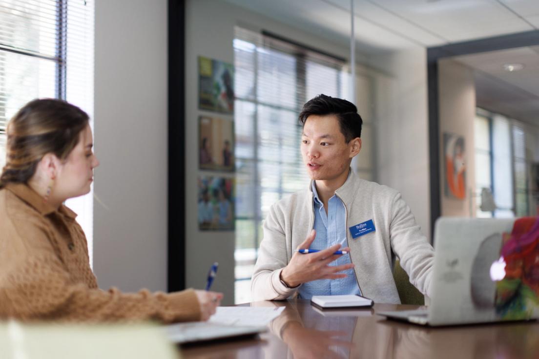 Rollins Professional Advancement advisor assisting a student. 