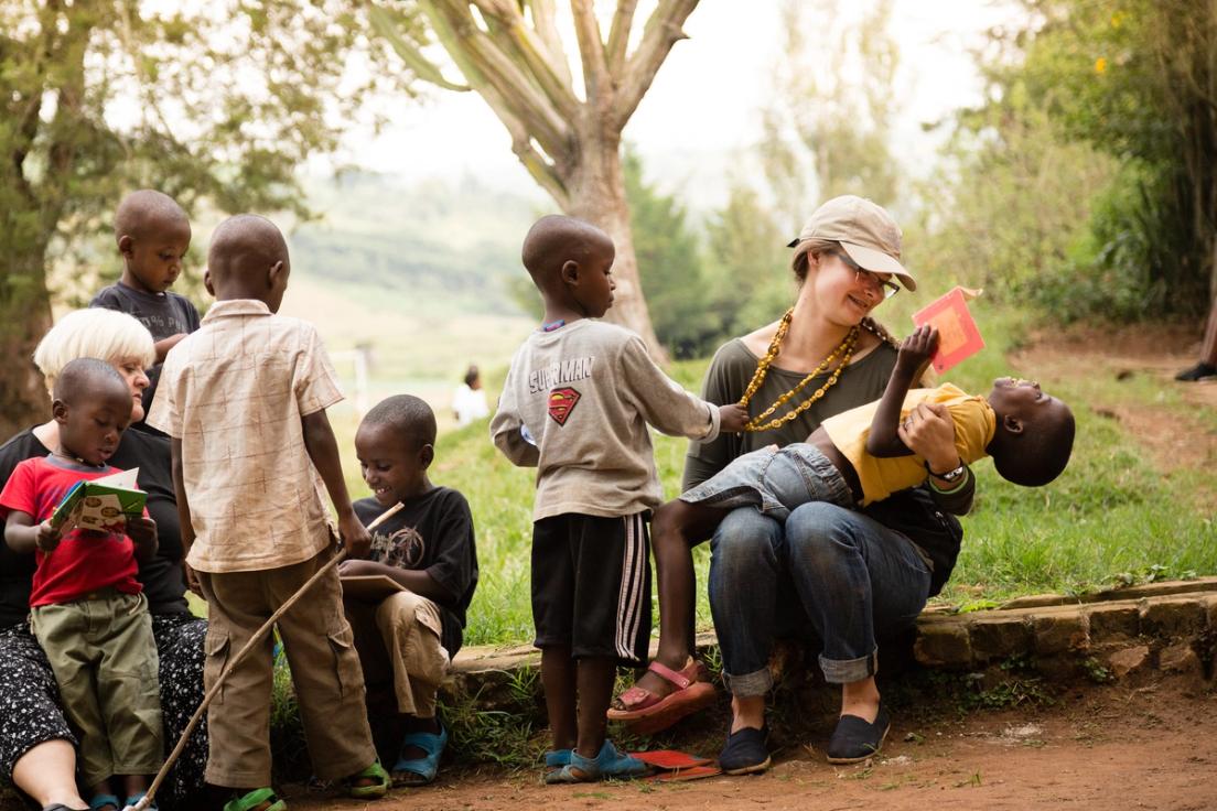 At Hameau des Jeanues orphanage, Professor of Communication Susan Easton and Danielle Loyd ’13 read books that they brought with them to the children staying at the orphanage.