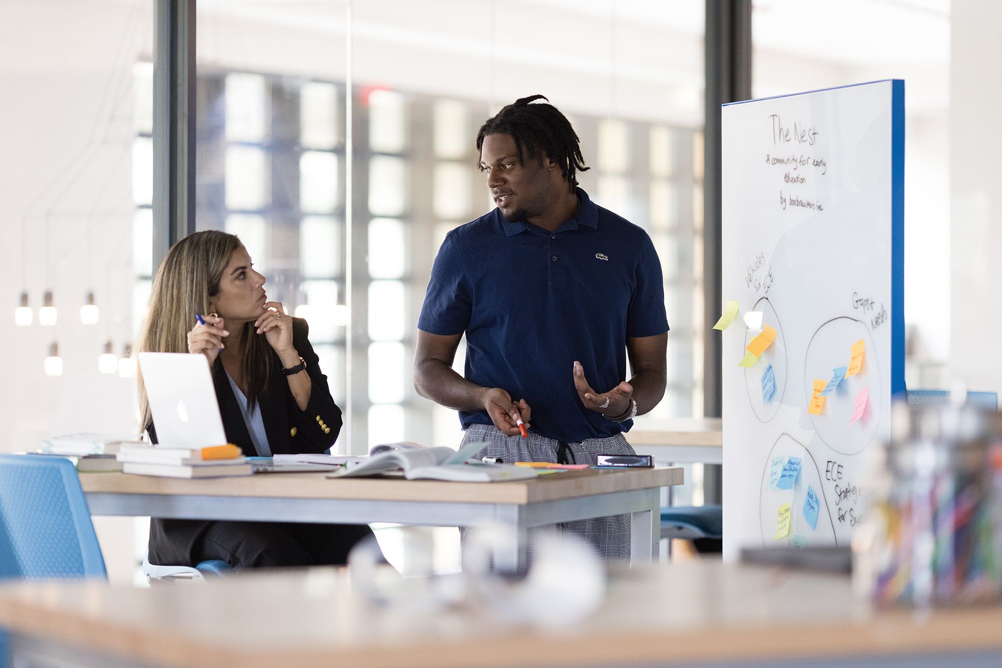 A student addresses a social justice panel during his social entrepreneurship class.