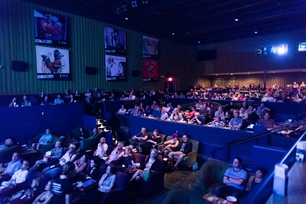 Students attend a film screening at the Enzian Theatre.