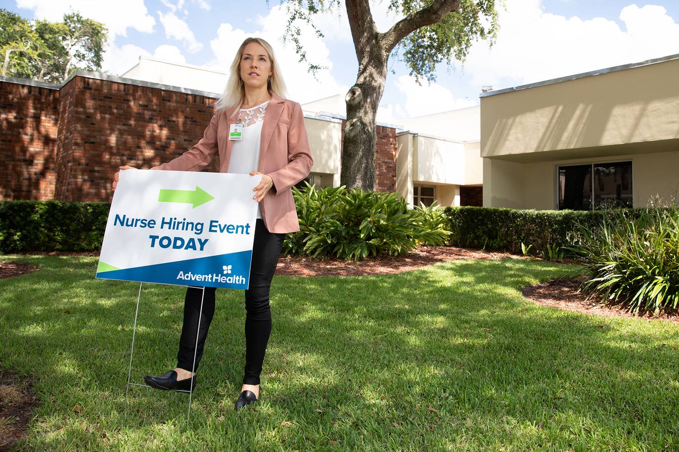 As part of her internship, Nina Steigerwald ’20 sets up signs to promote AdventHealth's employee wellness program. 
