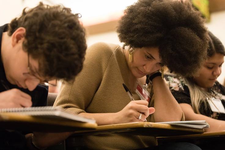 Students take notes during Winter With the Writers.